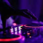Close up image of a hand using a DJ deck